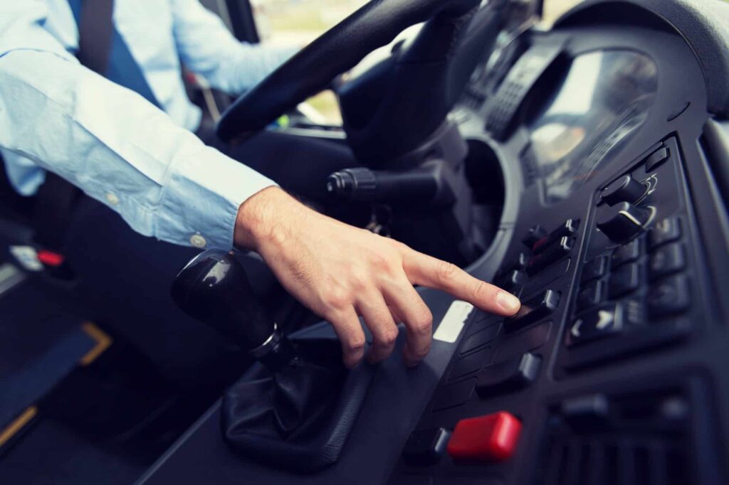 close up of driver driving passenger bus