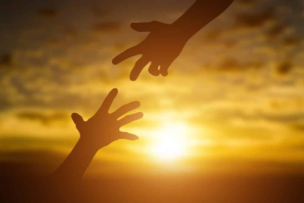 silhouette of giving a help hand hope and support 2025 01 08 12 51 38 utc